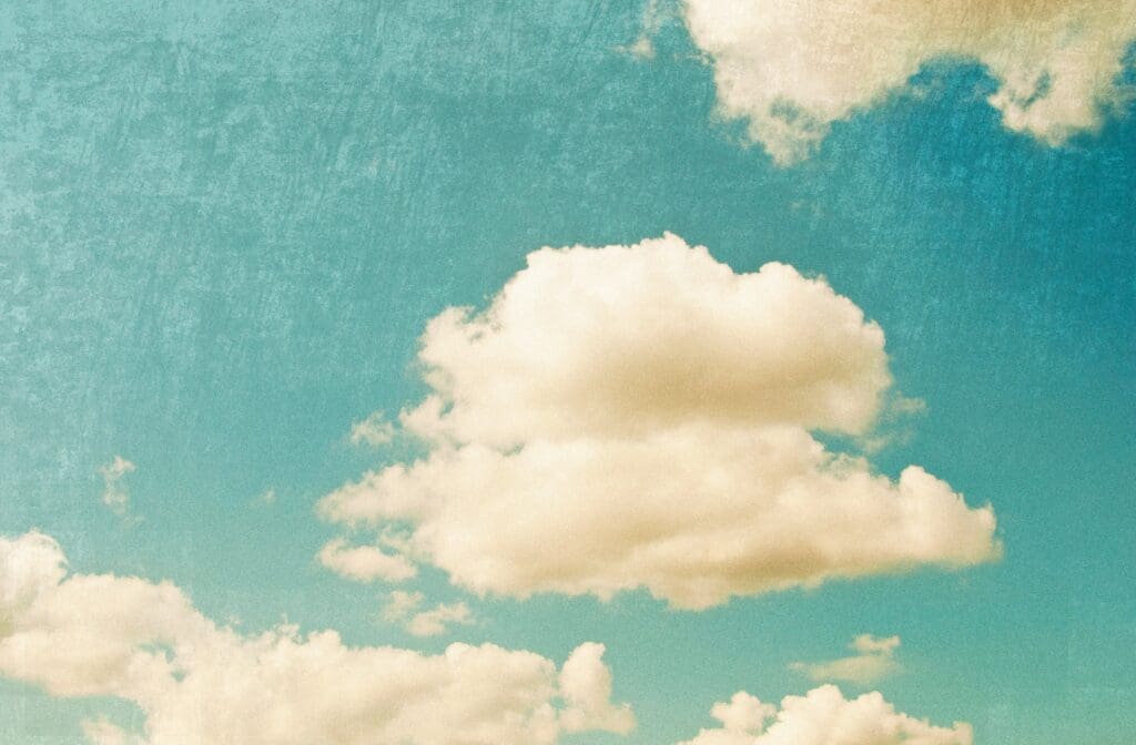 Retro sky and clouds graphic for a Zen Den blog post about cannabis HR support and workplace compliance.