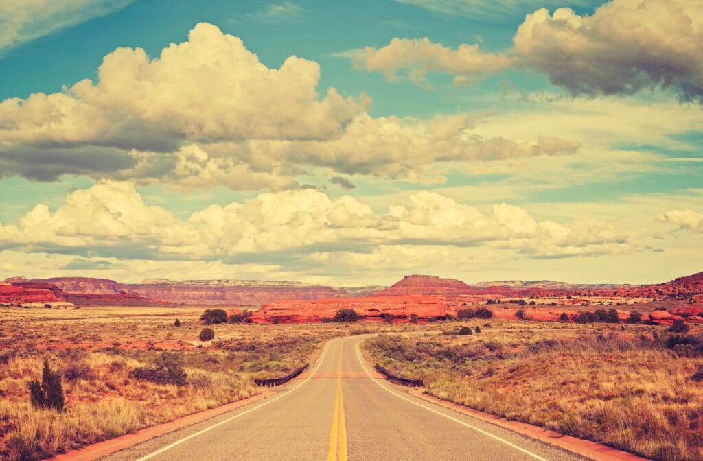 Open road through desert landscape for blog on four triggers cannabis operators need HR support.
