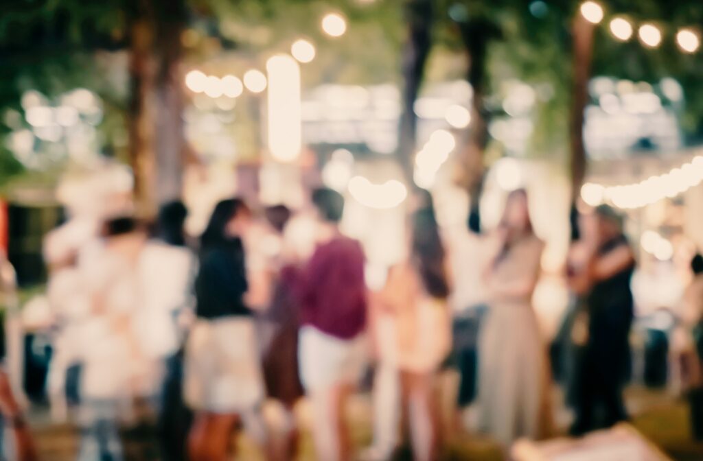 People networking outside at a cannabis events gathering